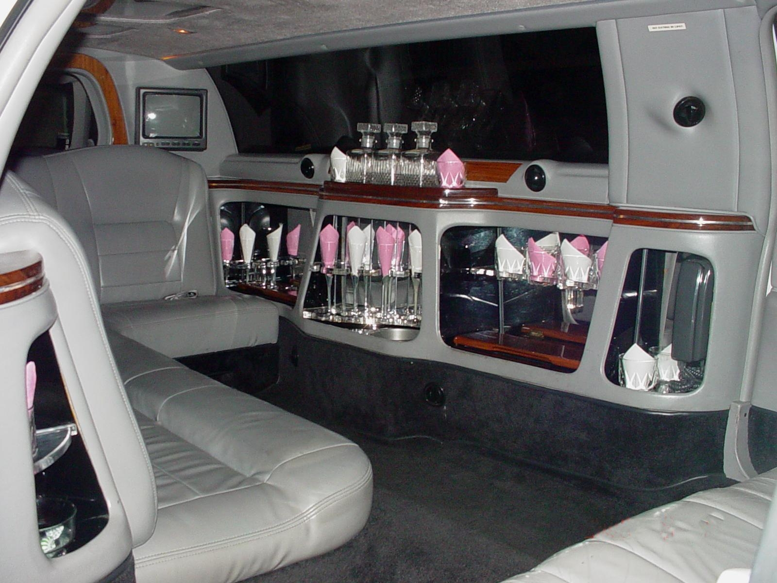 White Super Stretch Limo | Limousine With Sunroof | Wrap Around Sofa